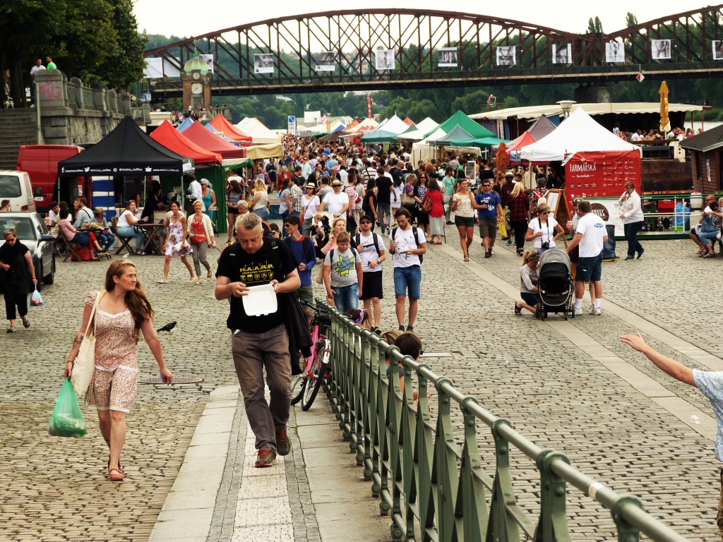 Look for the only railroad bridge crossing the river, and you'll know you've found the market at Náplavka.